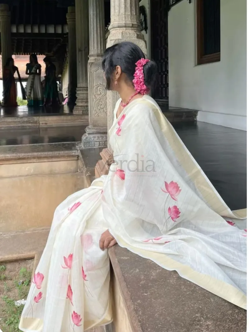 Floral printed linen saree with a golden zari border. view 2